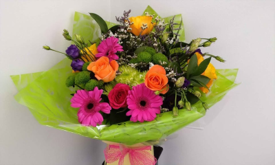 Vibrant Hand-Tied - A bold and uplifting hand-tied bouquet bursting with vibrant colour and fresh, lively energy. Beautifully arranged with a mix of bright tones and lush greenery, this design creates a striking and joyful display, perfectly finished with modern wrapping and a soft ribbon.

Ideal for celebrations, birthdays, or simply making someone smile, this bouquet is full of personality and guaranteed to brighten any space.
