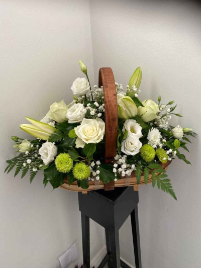 Serenity Garden Basket - A beautifully arranged basket design featuring soft, calming tones complemented by fresh greenery and natural textures. Presented in a classic handled basket, this arrangement offers a relaxed yet refined look, creating a sense of peace and understated elegance.

Perfect for sympathy, thoughtful gestures, or simply bringing a touch of calm into the home, this design is easy to display and crafted to offer comfort, beauty, and quiet charm.