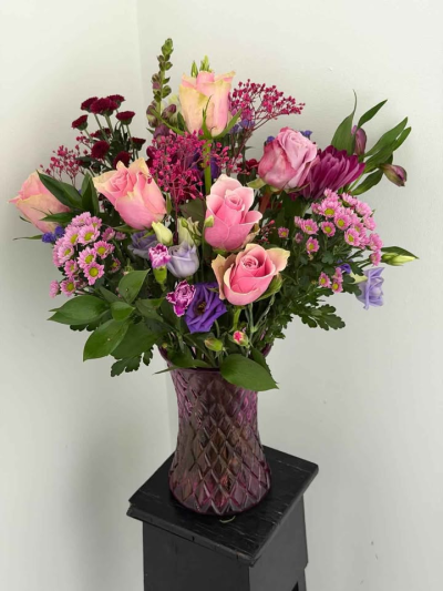 Rose Garden Vase - A beautifully arranged display of soft pink tones and delicate textures, presented in a stylish patterned vase. This design brings together gentle colour contrasts and fresh greenery to create a full, elegant arrangement with a natural garden-inspired feel.

Perfect for birthdays, anniversaries, or simply adding a touch of beauty to the home, this arrangement is ready to enjoy and makes a thoughtful and lasting gift.