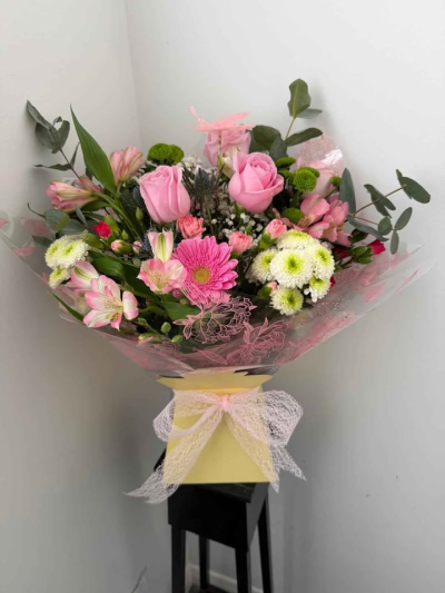 Sweet Blush Hand-Tied - A delicate and uplifting hand-tied bouquet featuring soft pink tones and fresh greenery, creating a light and natural feel. Beautifully wrapped and finished with a gentle ribbon, this arrangement offers a perfect balance of sweetness and elegance.

Ideal for birthdays, thank you gifts, or simply to brighten someone’s day, this bouquet brings a touch of warmth, charm, and effortless beauty to any occasion.