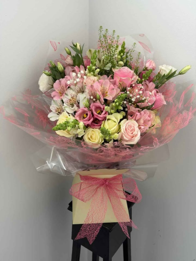 Blush Romance Hand-Tied - A soft and elegant hand-tied bouquet filled with delicate blush tones, gentle textures, and fresh natural movement. Beautifully wrapped and finished with a coordinating ribbon, this arrangement has a romantic garden-inspired feel that is both graceful and uplifting.

Perfect for birthdays, anniversaries, thank you gifts, or simply making someone feel special, this bouquet is designed to bring charm, beauty, and a lovely sense of occasion.