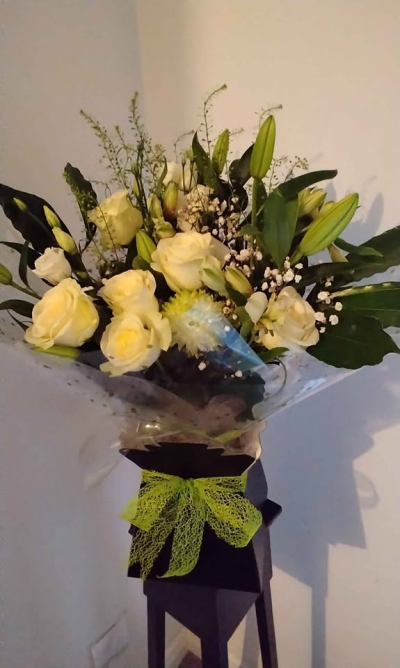 Graceful - A soft and graceful hand-tied bouquet inspired by natural meadow tones and gentle textures. With its relaxed, airy style and fresh greenery, this arrangement creates a beautifully light and elegant display, finished with modern wrapping and a delicate ribbon.

Perfect for sympathy, thoughtful gestures, or understated celebrations, this bouquet offers a calming presence and timeless charm.